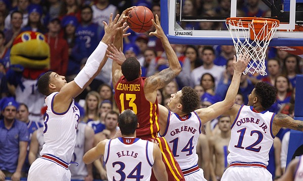 Kansas forward Landen Lucas, left, guards Brannen Greene, Kelly Oubre and forward Perry Ellis compete for a rebound with Iowa State guard Bryce Dejean-Jones during the first half on Monday, Feb. 2, 2015 at Allen Fieldhouse.