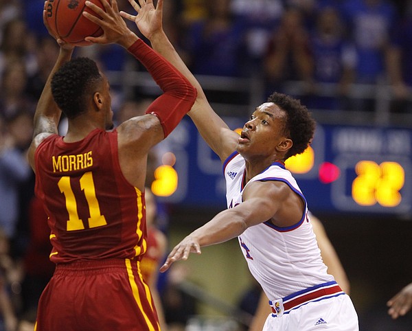 Kansas guard Devonte Graham (4) defends against a pass from Iowa State guard Monte Morris (11) during the first half on Monday, Feb. 2, 2015 at Allen Fieldhouse.
