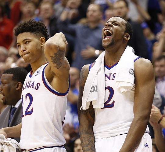 Kansas guard Kelly Oubre Jr., left, and forward Cliff Alexander celebrate a three by teammate Wayne Selden Jr. during the second half on Monday, Feb. 2, 2015 at Allen Fieldhouse.
