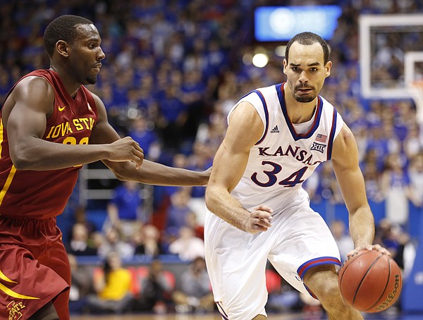 Kansas forward Perry Ellis (34) drives against Iowa State forward Dustin Hogue (22) during the second half on Monday, Feb. 2, 2015 at Allen Fieldhouse.