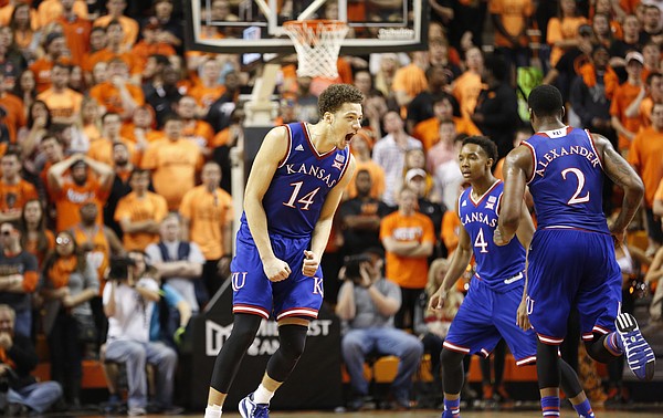 Kansas guard Brannen Greene (14) roars after a three during the first half on Saturday, Feb. 7, 2015 at Gallagher-Iba Arena.