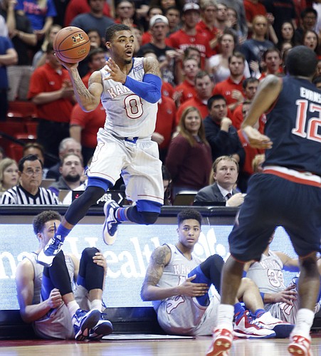 Kansas guard Frank Mason III, (0) saves a loose ball from going out of bounds during the first half on Tuesday, Feb. 10, 2015 at United Supermarkets Arena.