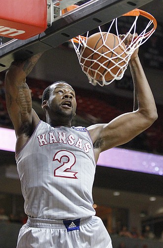 Kansas forward Cliff Alexander (2) dunks off a pass from Frank Mason III, in the second half of the Jayhawks 73-51 win over Texas Tech Tuesday, Feb. 10, 2015 at United Supermarkets Arena.