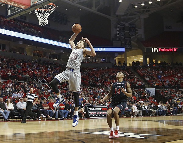 Kansas guard Brannen Greene (14) heads to the basket for two points on a fast break against Texas Tech Tuesday, Feb. 10, 2015 at United Supermarkets Arena.