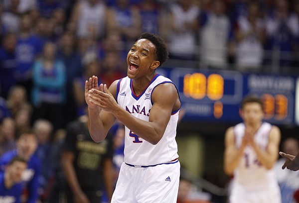 Kansas guard Devonte Graham (4) claps after forcing a turnover by Baylor guard Kenny Chery (1) during the first half, Saturday, Feb. 14, 2015 at Allen Fieldhouse.