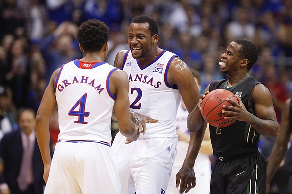 Kansas forward Cliff Alexander (2) comes in to celebrate with  guard Devonte Graham after Graham forced a turnover by Baylor guard Kenny Chery (1) during the first half, Saturday, Feb. 14, 2015 at Allen Fieldhouse.