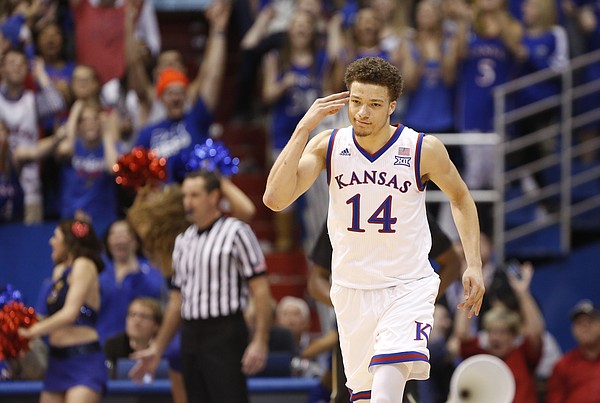 Kansas guard Brannen Greene (14) celebrates after hitting a three against Baylor during the second half, Saturday, Feb. 14, 2015 at Allen Fieldhouse.
