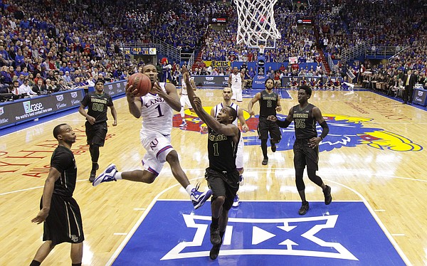 Kansas guard Wayne Selden Jr. (1) soars in to the bucket as he is fouled by Baylor guard Kenny Chery (1) during the second half, Saturday, Feb. 14, 2015 at Allen Fieldhouse.