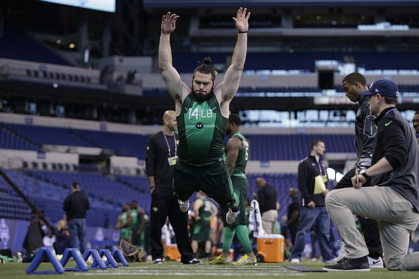 Kansas University linebacker Ben Heeney jumps during a drill at the NFL football scouting combine Sunday, Feb. 22, 2015, in Indianapolis.