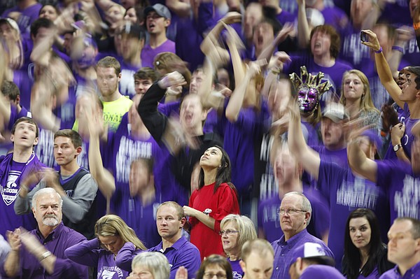 A lone Kansas fan watches the scoreboard in the middle of a raucous sea of purple during the second half, Monday, Feb. 23, 2015 at Bramlage Coliseum.