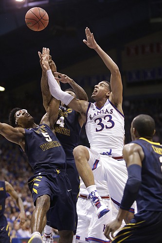 Kansas forward Landen Lucas (33) battles for a rebound during the Jayhawks game against the West Virginia Mountaineers Tuesday, March 4, 2015 at Allen Fieldhouse.