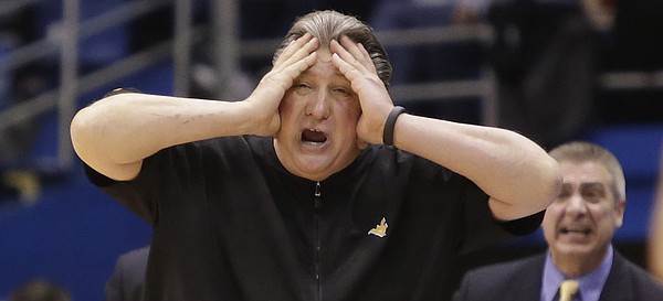 West Virginia coach Bobby Huggins reacts to turnover near the end of regulation during the Jayhawks win against the West Virginia Mountaineers Tuesday, March 4, 2015 at Allen Fieldhouse.