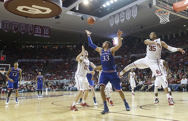 Kansas forward Landen Lucas (33) grabs a 2nd-half rebound during the Jayhawks 75-73 loss to the Oklahoma Sooners Saturday, March 7, 2015 in Norman.