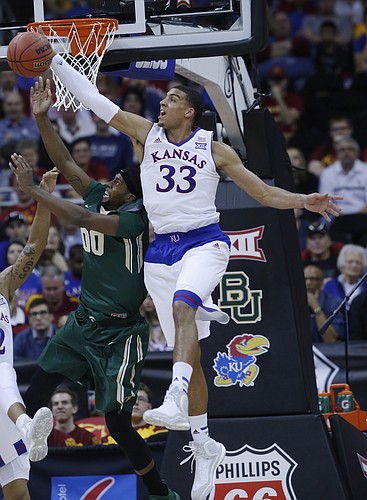 Kansas forward Landen Lucas (33) collects a rebound in the Jayhawk’s 62-52 win over Baylor in the semi-final of the Big 12 Tournament Friday at the Sprint Center in Kansas City, MO.
