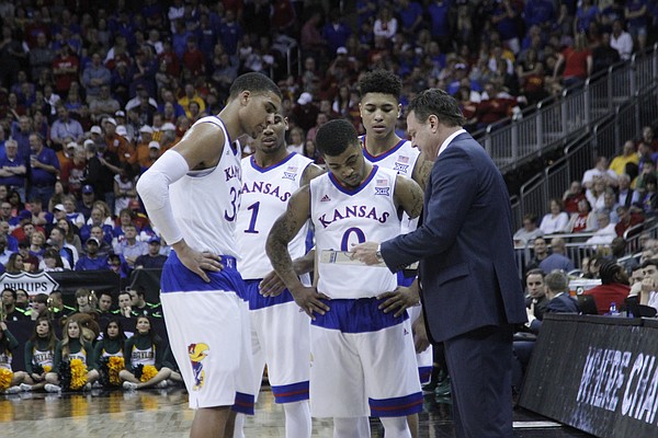 KU coach Bill Self talks to the team during a timeout in the closing minutes of the Jayhawk’s 62-52 win over Baylor in the semi-final of the Big 12 Tournament Friday.