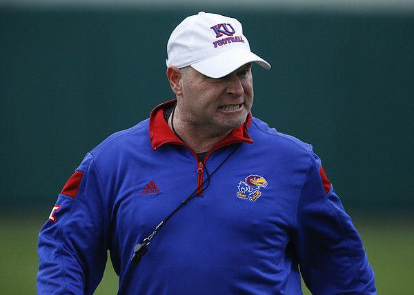 Kansas co-defensive coordinator and cornerbacks coach Kenny Perry grits his teeth as he prepares to give some criticism during spring practice on Tuesday, March 24, 2015.