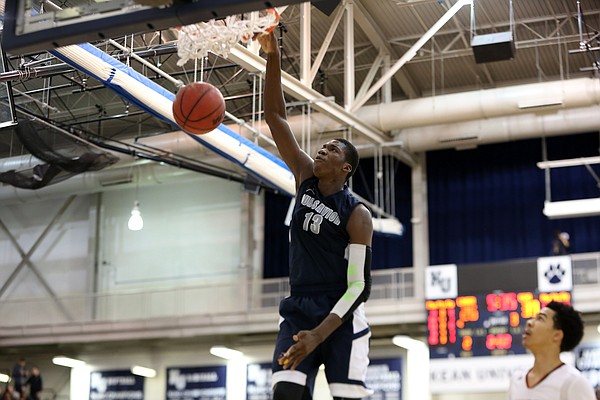 Our Savior New American's Cheick Diallo #13 dunks against Linden during a high school basketball game on Friday, Feb. 13, 2015, in Kean, NJ. Our Savior won the game. (AP Photo/Gregory Payan)

