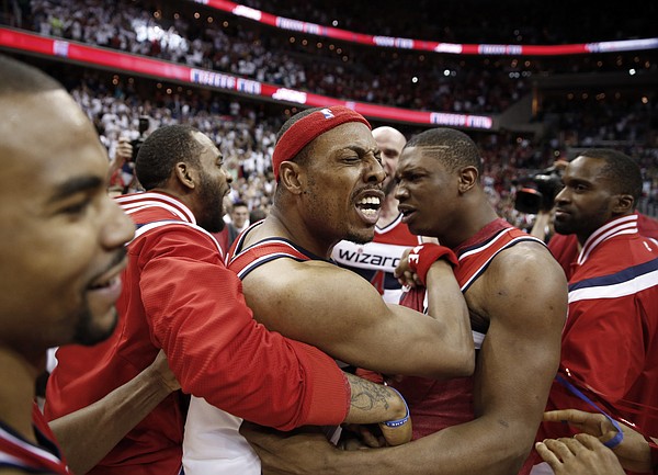 Washington Wizards forward Paul Pierce, in headband, celebrates with his teammates after Game 3 of the second round of the NBA basketball playoffs against the Atlanta Hawks, Saturday, May 9, 2015, in Washington. The Wizards won 103-101. (AP Photo/Alex Brandon)

