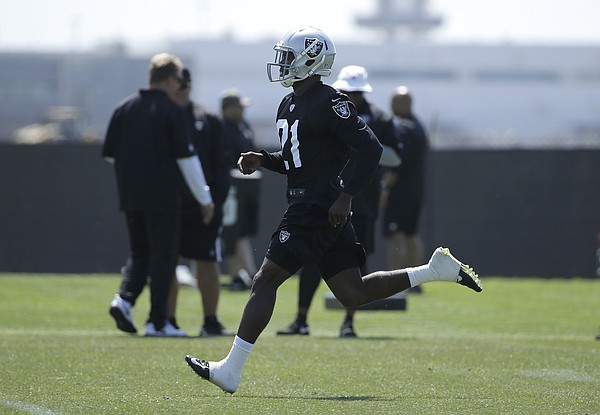 Oakland Raiders cornerback Dexter McDonald (21) runs during a rookie minicamp at an NFL football facility in Alameda, Calif., Friday, May 8, 2015. (AP Photo/Jeff Chiu)
