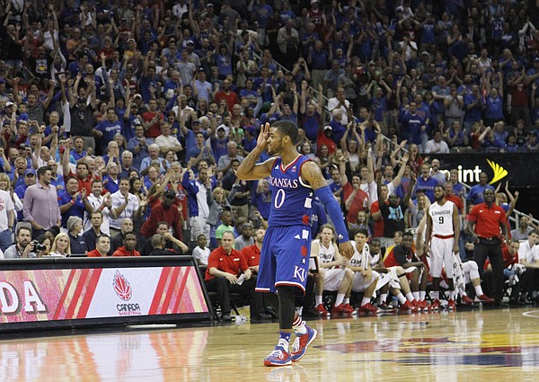Kansas guard Frank Mason III (0) signals the bench and crowd after hitting a three-point basket near the end of a 91-83 Team USA exhibition game win against Canada Tuesday, June 23, at the Sprint Center in K.C., MO.
