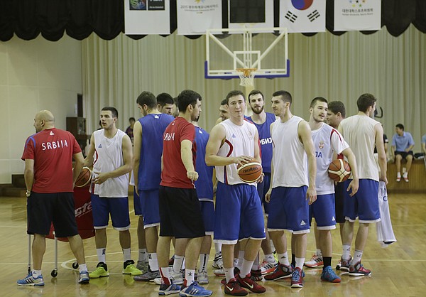 Members of the Serbian team break from a huddle at the end of their practice before Team USA took the court for a practice at Gwangju High School Wed., July 1. Team USA will play an exhibition game against China on Thursday, July 2 and will play Serbia in tournament pool play Wed., July 8. 