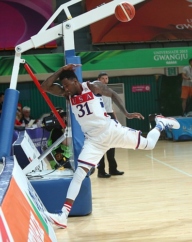 Kansas forward Jamari Traylor attempts to save a ball from going out of bounds in a Team USA 66-65 win against Serbia Wednesday, July 8, at the World University Games in South Korea.
