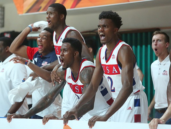 The Team USA bench celebrates a slam dunk by Kansas guard Wayne Selden Jr. in a Team USA 96-57 win over Switzerland Thursday, July 9, at the World University Games in South Korea.
