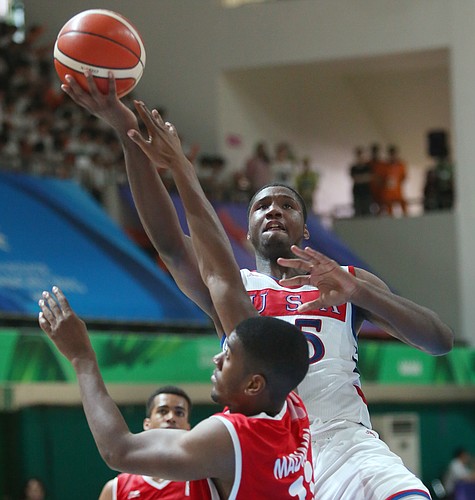 Kansas forward Carlton Bragg (15) drives to the basket for two of his 9 points in a Team USA 96-57 win over Switzerland Thursday, July 9, at the World University Games in South Korea.