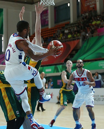Kansas guard Frank Mason III (0) passes to Perry Ellis, (34) right from beneath the basket in a Team USA quarter-final game against Lithuania Saturday, July 11, at the World University Games in Gwangju, South Korea.