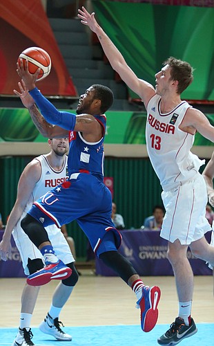 Kansas guard Frank Mason III (0) runs past Russian guard Artem Vikhrov (13) on a drive to the basket in a Team USA semi-final win against Russia Sunday, July 12, at the World University Games in South Korea.