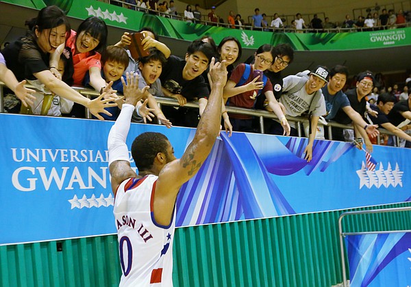 Kansas guard Frank Mason III (0) runs past celebrating fans after a Team USA double-overtime win against Germany Monday, July 13, at the World University Games in South Korea.