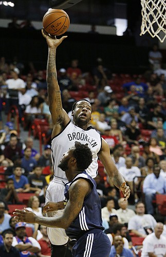 Brooklyn Nets’ Cliff Alexander goes up for a shot against New Orleans Pelicans’ Victor Rudd during the first half of an NBA summer league basketball game Monday, July 13, 2015, in Las Vegas. (AP Photo/John Locher)