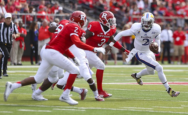 Kansas quarterback Montell Cozart (2) has nowhere to go as he is surrounded by Rutgers defensive back Kiy Hester (2) and linebacker Steve Longa (3) during the third quarter on Saturday, Sept. 26, 2015 at High Point Solutions Stadium in Piscataway, New Jersey.