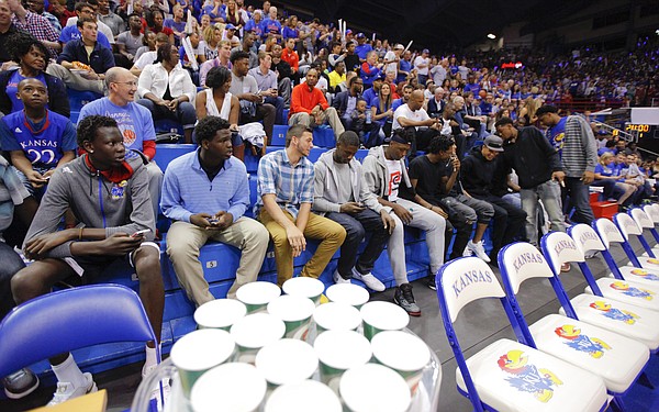 A long row of Kansas recruits sit to watch the Late Night in the Phog festivities, Friday, Oct. 9, 2015 at Allen Fieldhouse.
