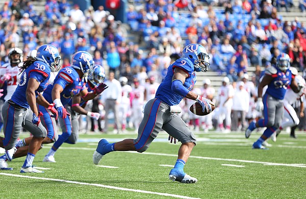 Kansas safety Fish Smithson (9) returns a fumbled ball by Texas Tech deep into the Red Raiders' territory during the fourth quarter on Saturday, Oct. 17, 2015 at Memorial Stadium.