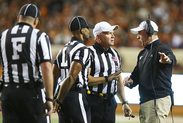 Kansas head coach David Beaty argues with officials during the second quarter on Saturday, Nov. 7, 2015 at Darrell K. Royal Stadium in Austin, Texas.