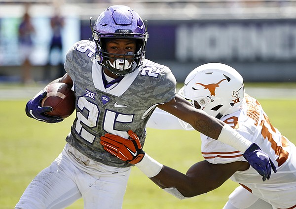 TCU wide receiver KaVontae Turpin (25) tries to get outside of Texas linebacker Peter Jinkens (19) in the second half of an NCAA football game Saturday, Oct. 3, 2015, in Fort Worth, Texas. (AP Photo/Ron Jenkins)