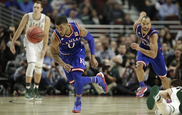 Kansas guard Frank Mason III (0) chases down a ball during the second half, Tuesday, Nov. 17, 2015 at United Center in Chicago.