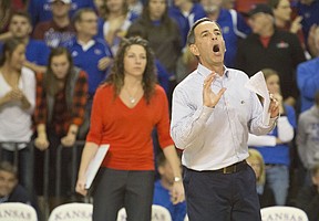 Kansas coach Ray Bechard shouts in instructions from the sideline as associate head coach Laura "Bird" Kuhn looks on during Kansas' second round NCAA volleyball tournament match against Missouri in 2015 at the Horejsi Center. The Jayhawks sent the Tigers packing with a three set sweep. 