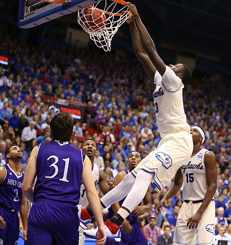 Kansas forward Cheick Diallo (13) throws down a dunk against Holy Cross during the second half, Wednesday, Dec. 9, 2015 at Allen Fieldhouse.