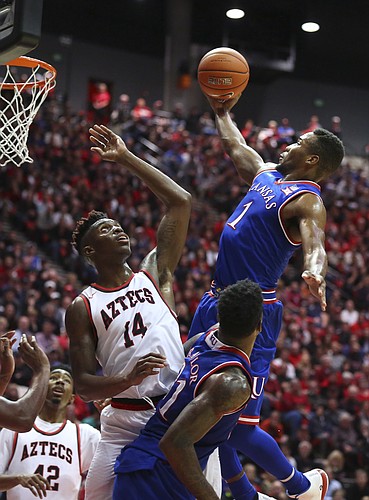 Kansas guard Wayne Selden Jr. (1) floats in for a bucket over San Diego State forward Zylan Cheatham (14) during the second half, Tuesday, Dec. 22, 2015 at Viejas Arena in San Diego.