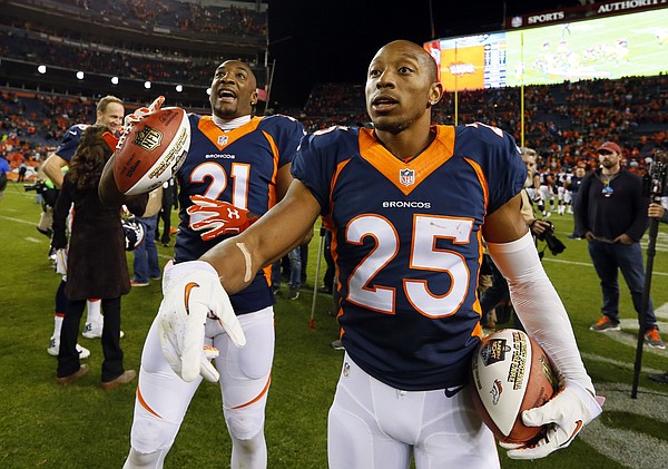 Denver Broncos cornerback Chris Harris (25) and Denver Broncos cornerback Aqib Talib (21) celebrate after an NFL football game against the Green Bay Packers, Sunday, Nov. 1, 2015, in Denver. The Broncos won 29-10 to improve to 7-0. (AP Photo/Joe Mahoney)