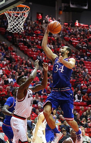 Kansas forward Perry Ellis (34) gets up for a bucket against San Diego State forward Zylan Cheatham (14) during the second half, Tuesday, Dec. 22, 2015 at Viejas Arena in San Diego.