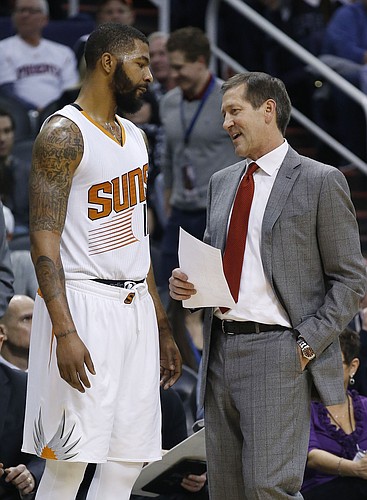 Phoenix Suns head coach Jeff Hornacek, right, talks with Markieff Morris, left, during the first half of an NBA basketball game against the Denver Nuggets Wednesday, Dec. 23, 2015, in Phoenix. (AP Photo/Ross D. Franklin)