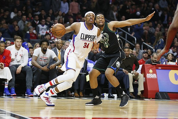 Los Angeles Clippers' Paul Pierce, left, dribble against Milwaukee Bucks' Jabari Parker during the first half of an NBA basketball game, Wednesday, Dec. 16, 2015, in Los Angeles. (AP Photo/Danny Moloshok)