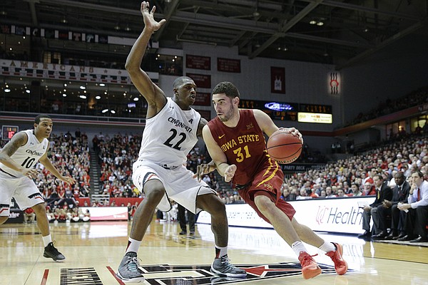 Iowa State’s Georges Niang (31) drives against Cincinnati’s Coreontae DeBerry (22) during the Cyclones’ 81-79 victory over the Bearcats Tuesday, Dec. 22 in Cincinnati. Niang and the Cyclones are among the challengers to Kansas’ streak of 11-straight Big 12 regular season titles.