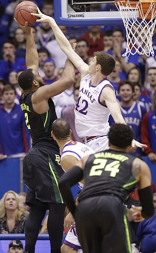 Kansas forward Hunter Mickelson (42) gets a hand on a shot by Baylor forward Rico Gathers (2) during the first half, Saturday, Jan. 2, 2016 at Allen Fieldhouse.