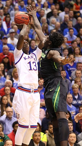 Kansas forward Cheick Diallo (13) puts up a shot over Baylor forward Johnathan Motley (5) during the first half, Saturday, Jan. 2, 2016 at Allen Fieldhouse.