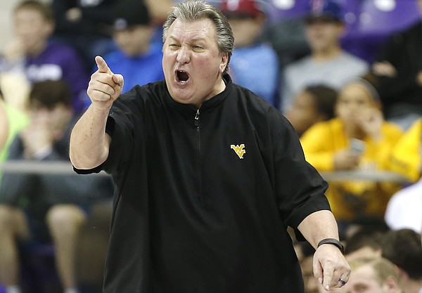West Virginia head coach Bob Huggins shouts instructions to his players during the first half of an NCAA college basketball game against TCU Monday, Jan. 4, 2016, in Fort Worth, Texas. (AP Photo/Brandon Wade)