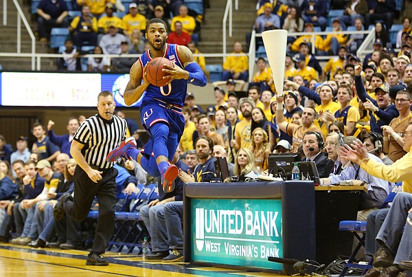 Kansas guard Frank Mason Jr., (0) jumps to make a cross court pass and break a press in a game between the Jayhawks and the Mountaineers at the WVU Colliseum in Morgantown, W.V. Tuesday.
